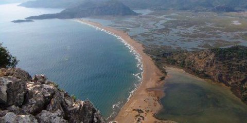 A sandy beach and lagoon on the Turkish coast seen from a cliff