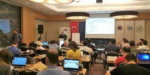 Participants at laptops during a workshop in Antalya