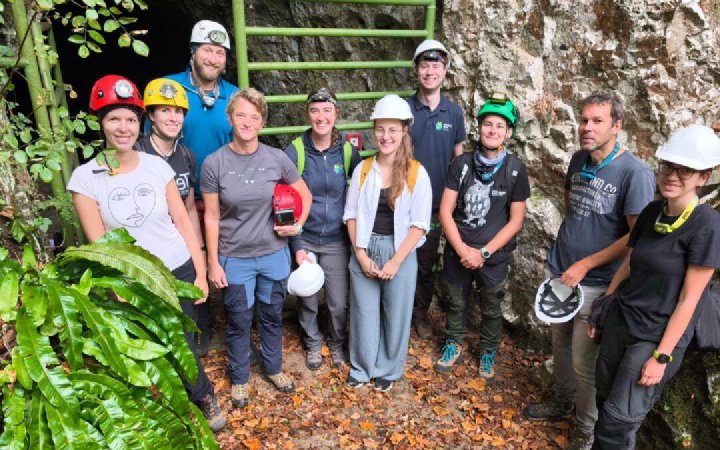 EcoSymbia ecologists on a field visit at a cave entrance