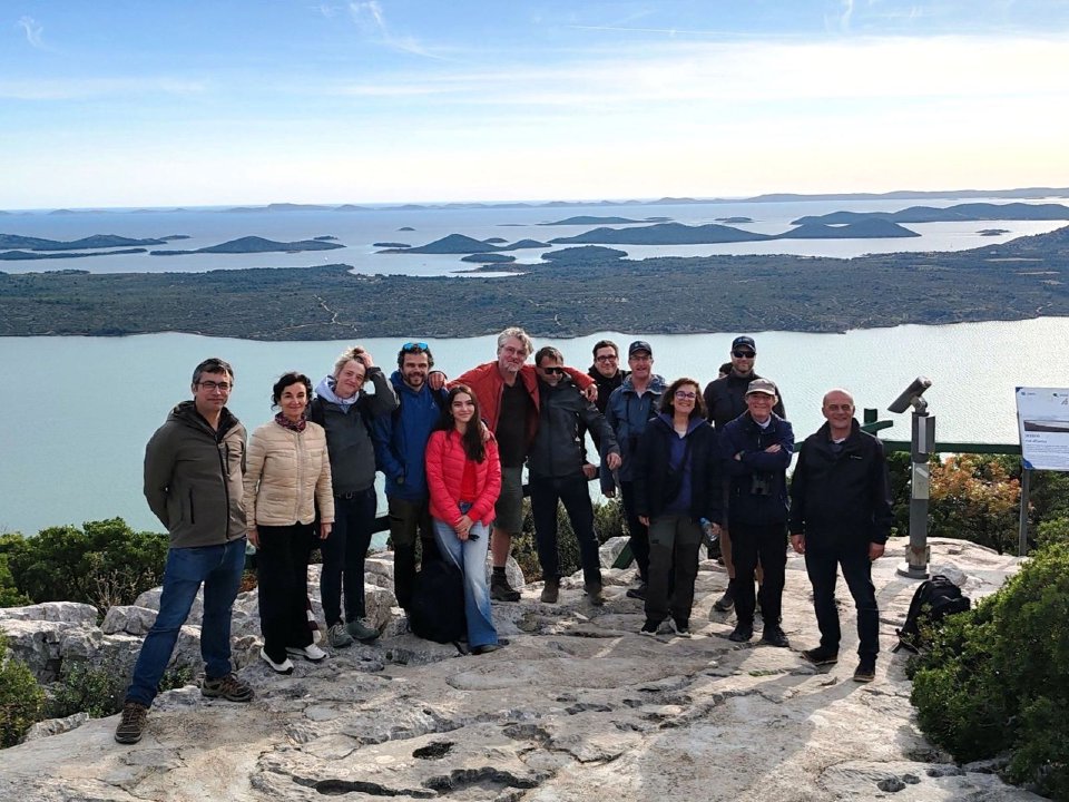 EcoSymbia partners together on a field visit overlooking an island archipelago